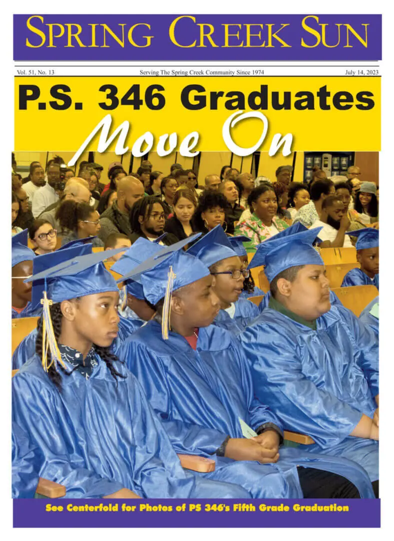 P.S. 346 graduates celebrating in blue caps and gowns.
