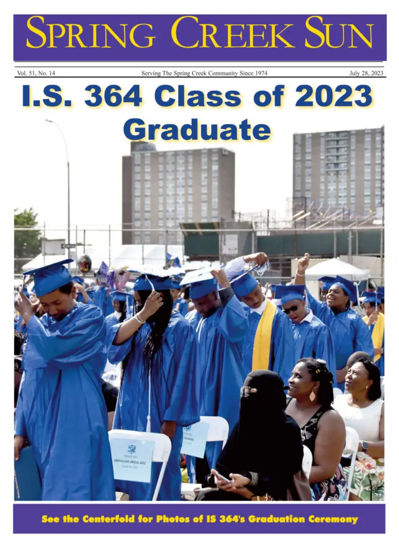 Graduates in blue caps and gowns celebrating at I.S. 364 Class of 2023 ceremony.
