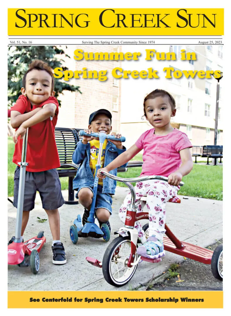 Kids enjoying summer fun at Spring Creek Town on bikes and scooters.